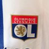 maillotOLdomicileLOGO.jpg Maillot Olympique Lyonnais Domicile 2024-2025 detail tissu