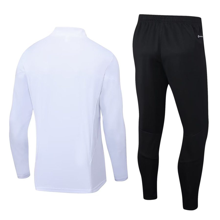 survetement-blanc-manchester-united-saison-2023-2024-veste-et-pantalon Wit trainingspak Manchester United seizoen 2023 2024 jas en broek